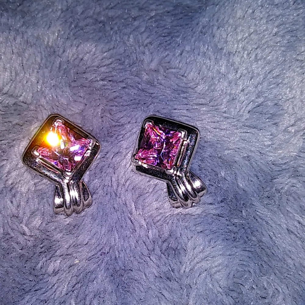 Silver earrings with sparkly pink CZ stones.